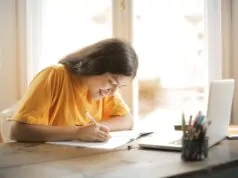 woman writing smiling scaled
