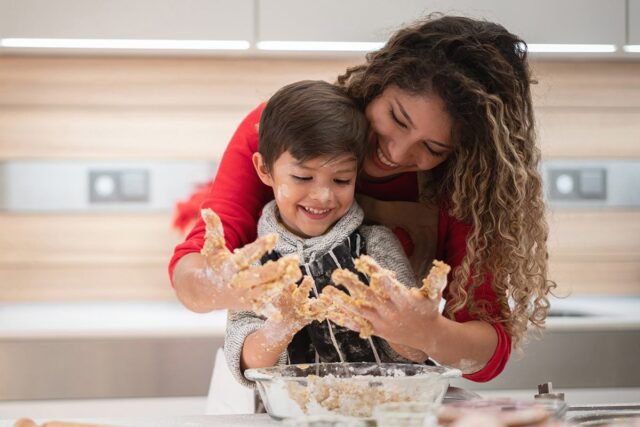 Mother and child bonding over dough kneading.