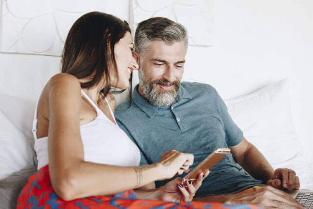 Couple using their phone while on vacation