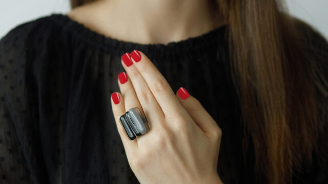 The little black dress combined with red nail polish