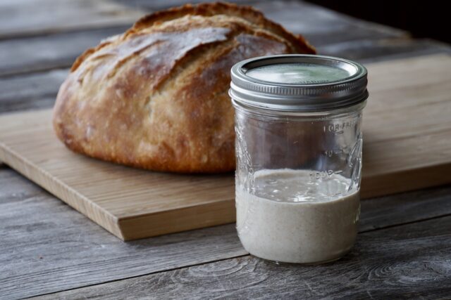 Sourdough bread loaf with sourdough starter